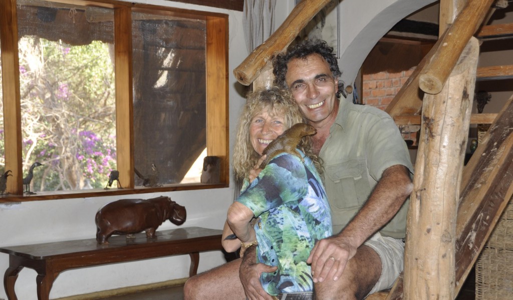 Karen, her husband Jean and the wild mongoose they are raising, 